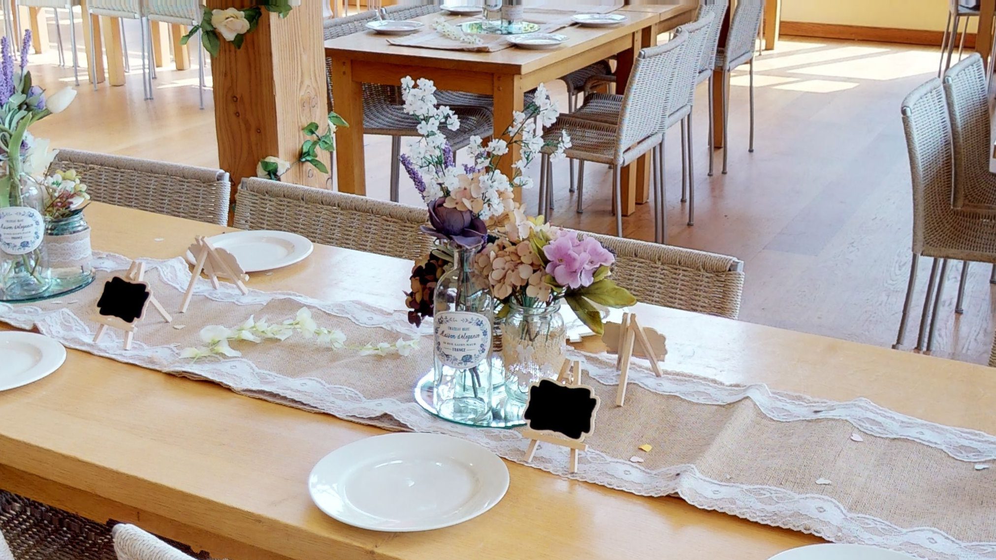 A closeup of a table dressed for a wedding